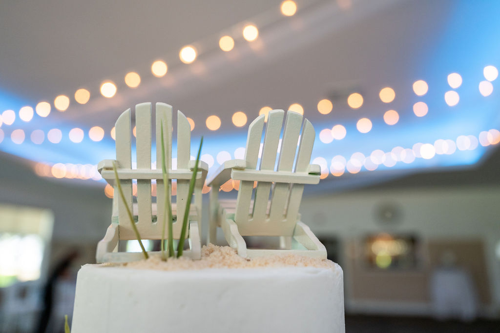 Life In Focus Wedding Photographer York cake topper with white beach chairs