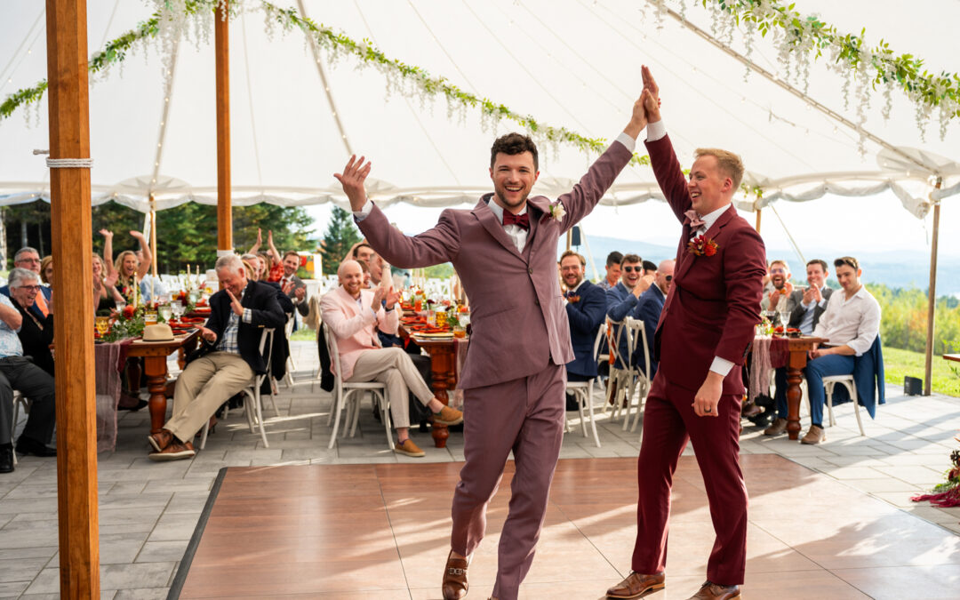 life in focus wedding photography and videography, grooms high five during tented wedding reception